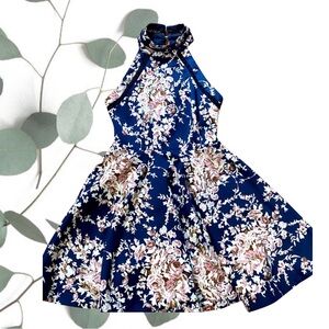 Halter dress in a beautiful navy blue floral pattern.